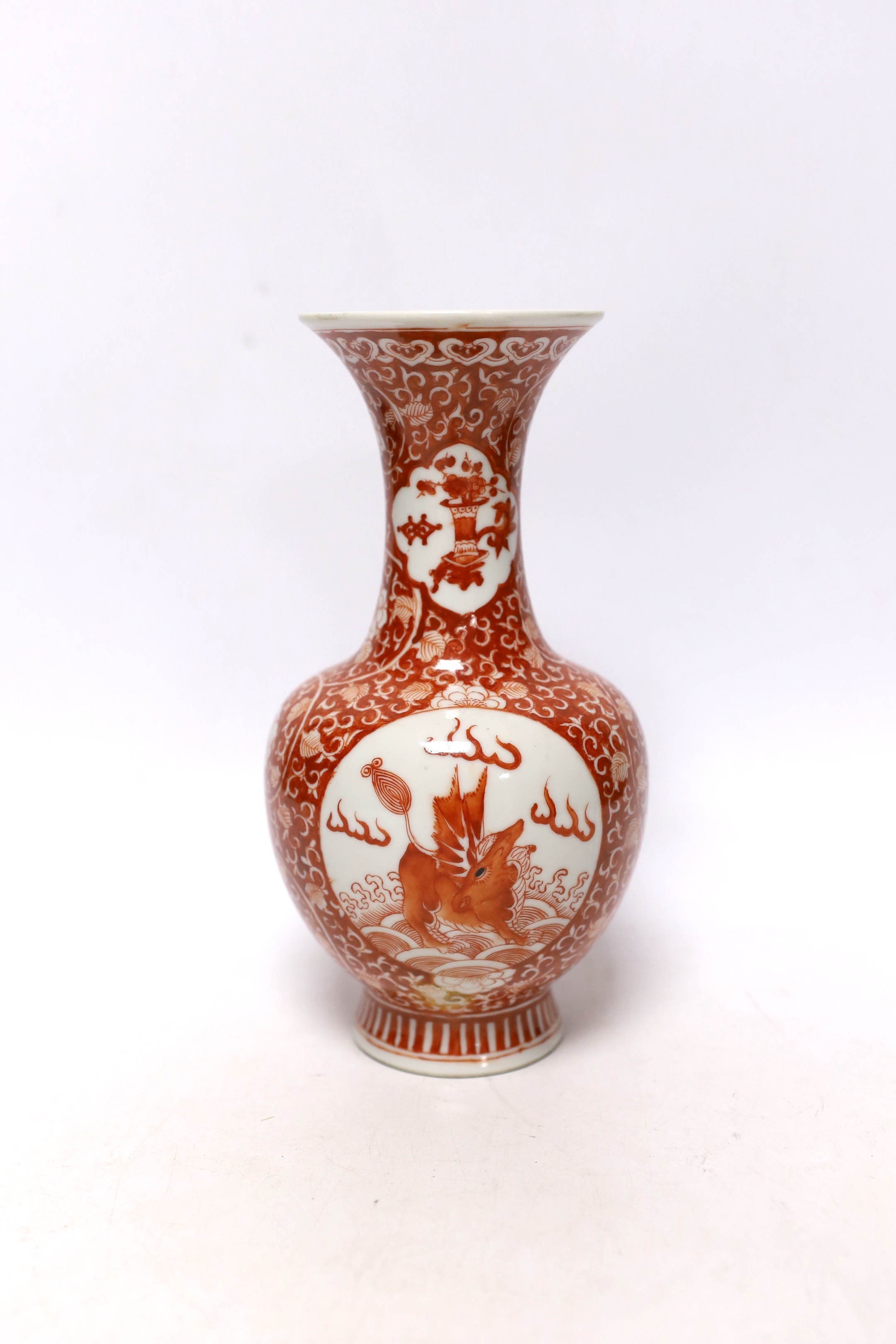 A Chinese iron red enamelled 'mythical beast' vase, early 20th century, 21cm high